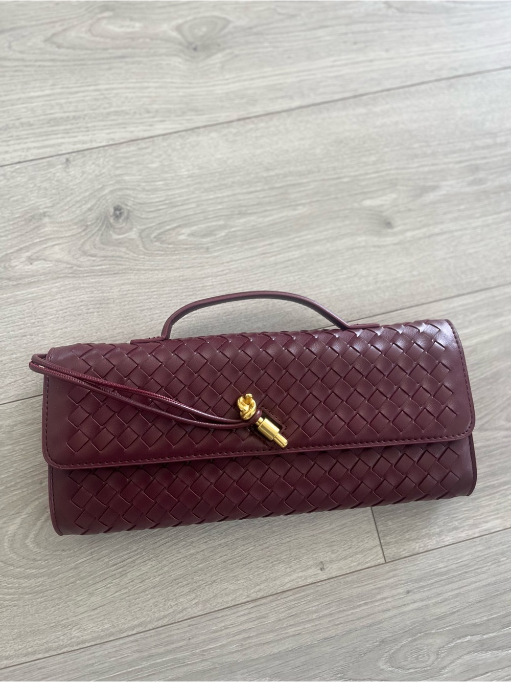 Anthropologie Burgundy Woven Leather Clutch with Gold Tassel